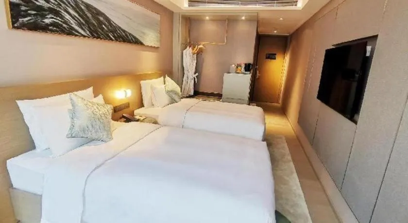 Bed in Kecheng Holiday Hotel