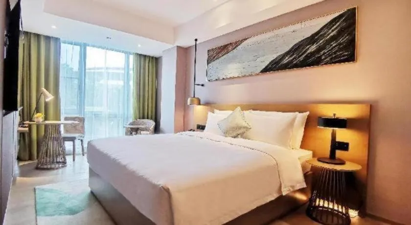 Bed in Kecheng Holiday Hotel