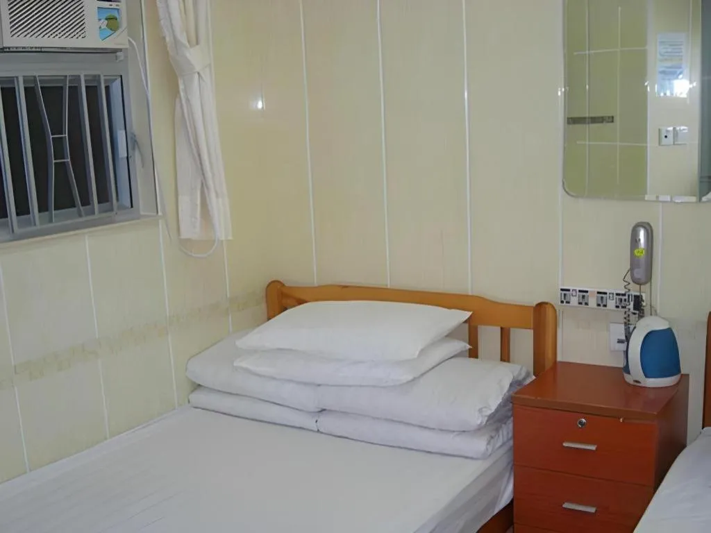 Bed in New Mong Kok Guest House