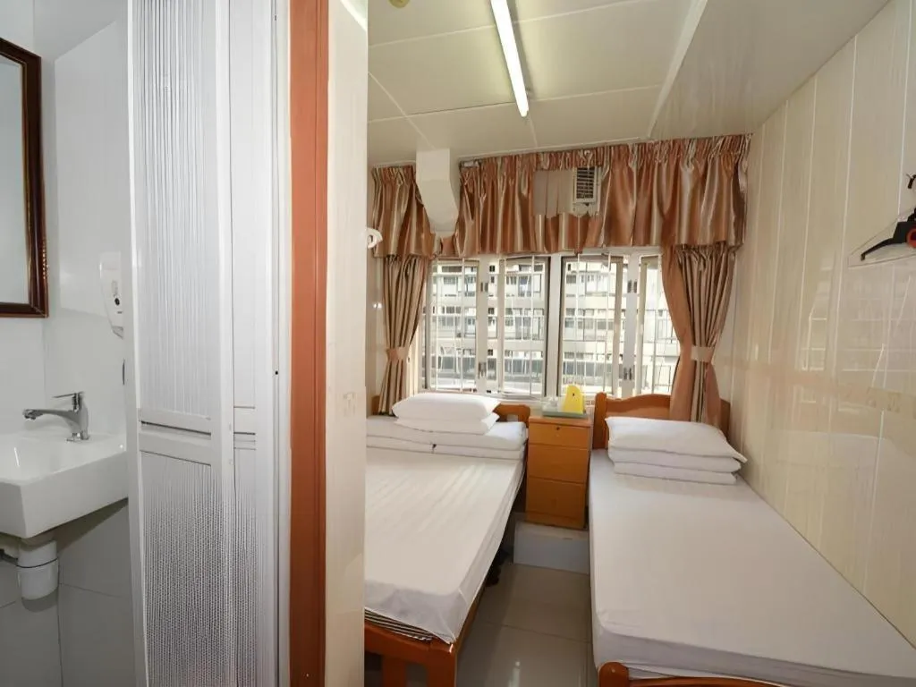 Bed in New Mong Kok Guest House