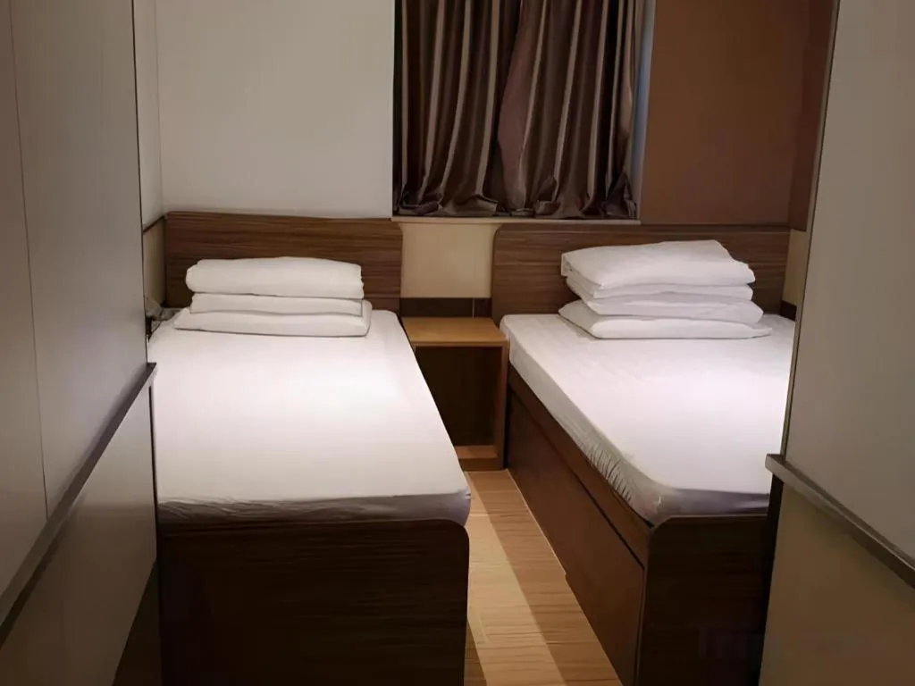 Bed in New Mong Kok Guest House