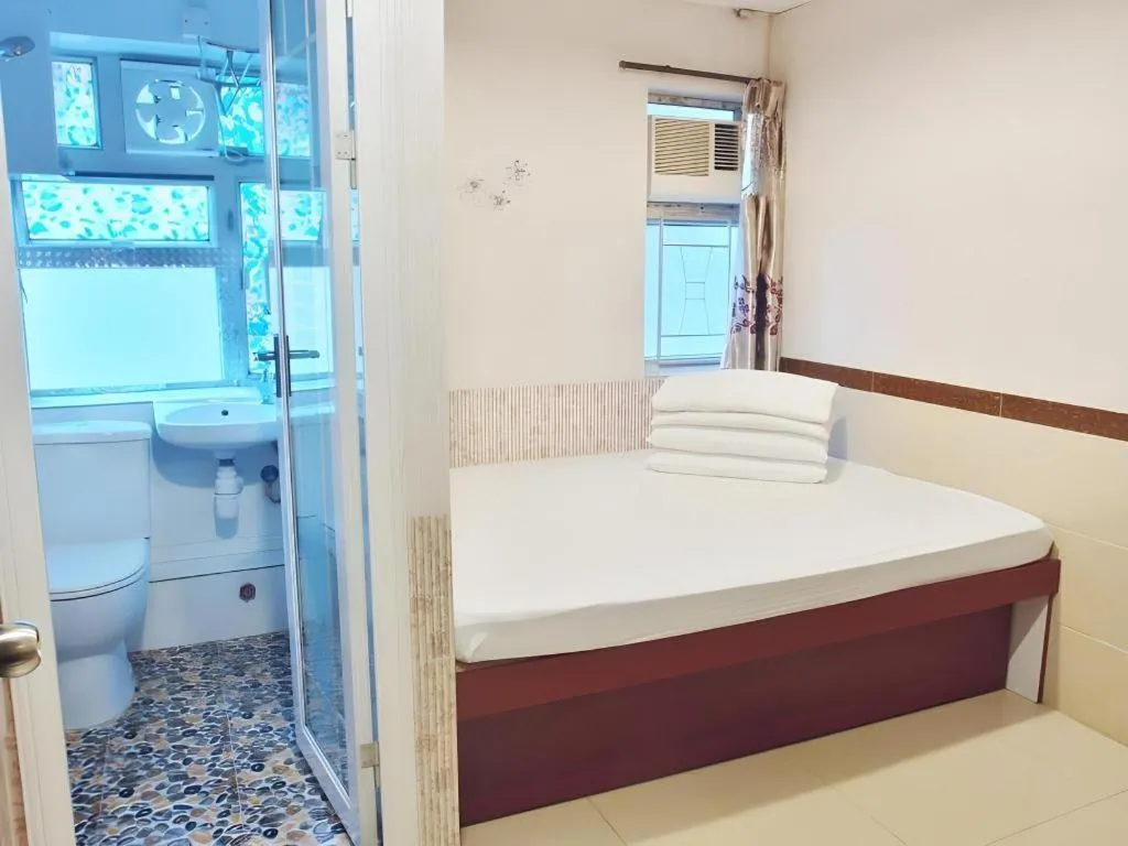 Bed in New Mong Kok Guest House
