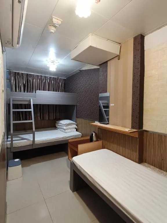 Bed in New Mong Kok Guest House