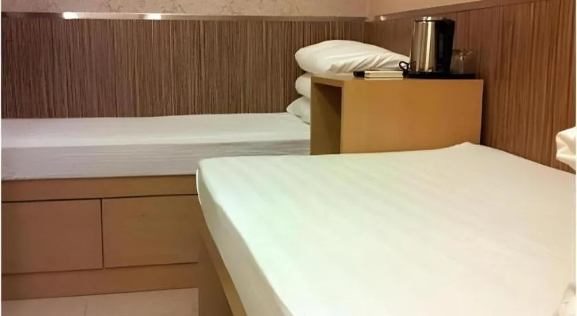 Bed in New Mong Kok Guest House