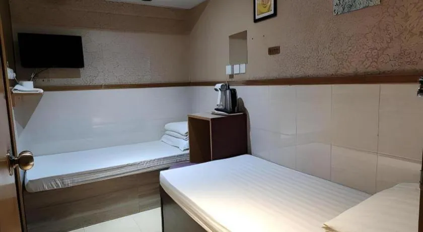 Bed in New Mong Kok Guest House