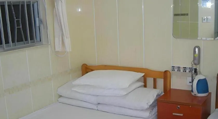 Bed in New Mong Kok Guest House