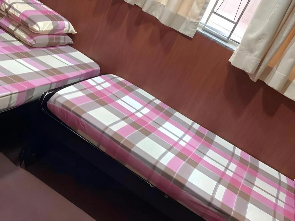 Bed in New Mong Kok Guest House