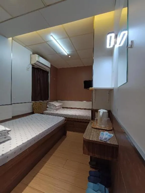 Bed in New Mong Kok Guest House