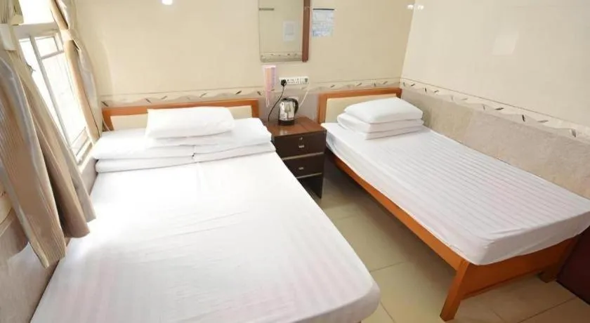 Bed in New Mong Kok Guest House