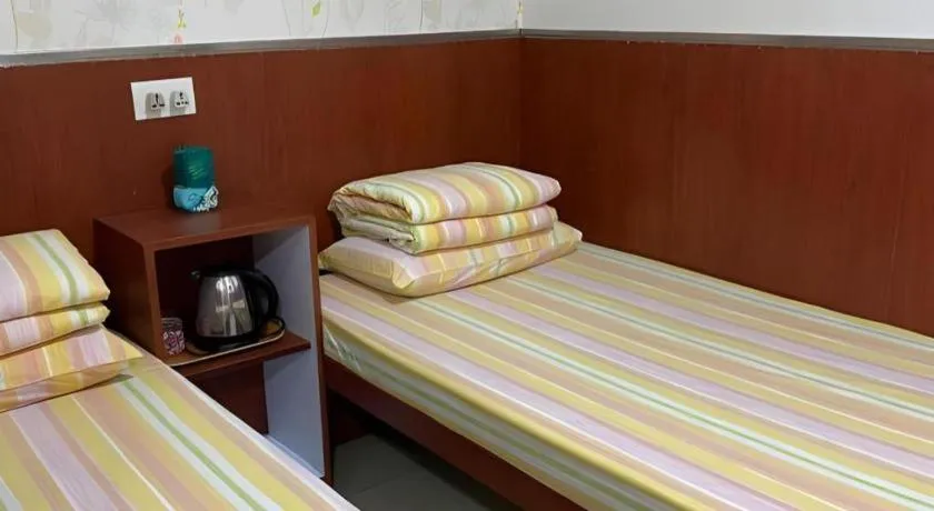 Bed in New Mong Kok Guest House