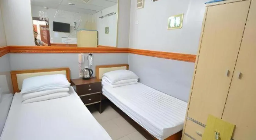 Bed in New Mong Kok Guest House