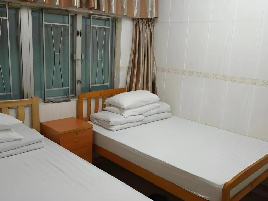Bed in New Mong Kok Guest House