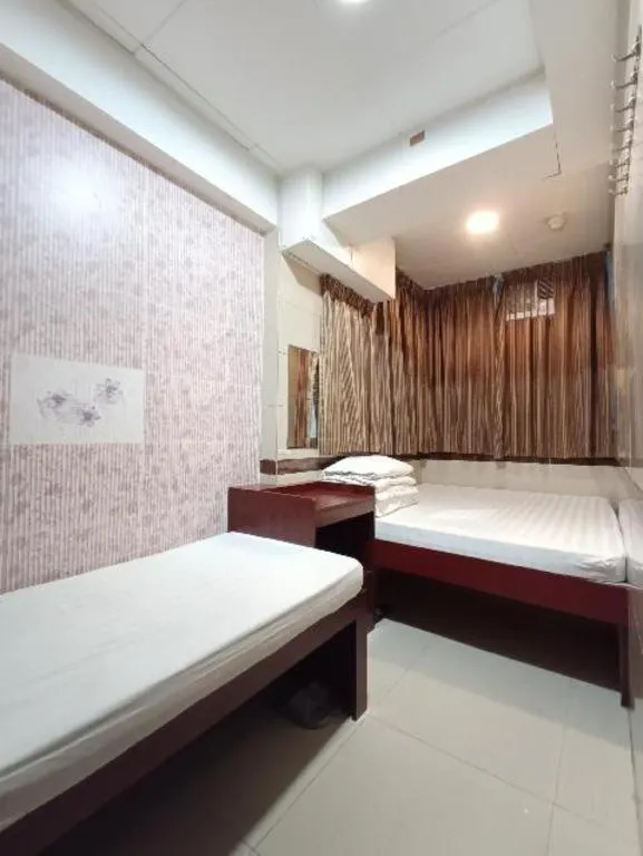 Bed in New Mong Kok Guest House