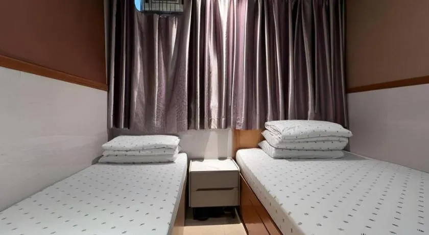 Bed in New Mong Kok Guest House