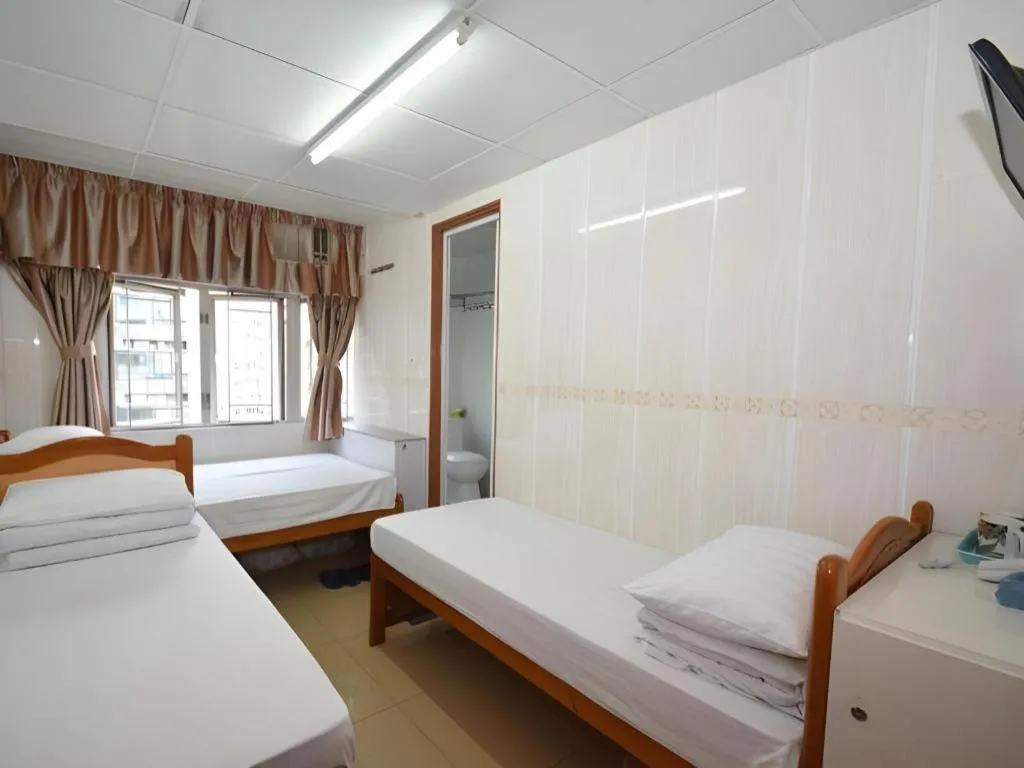 Bed in New Mong Kok Guest House