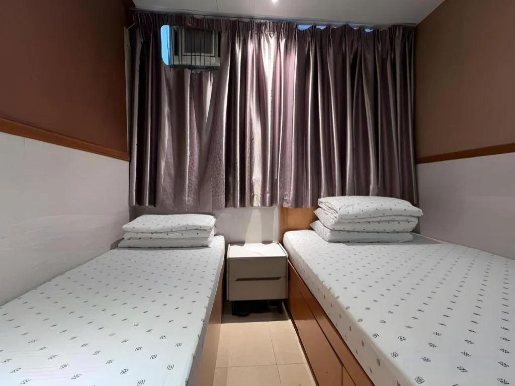 Bed in New Mong Kok Guest House