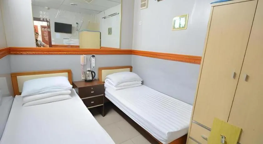 Bed in New Mong Kok Guest House