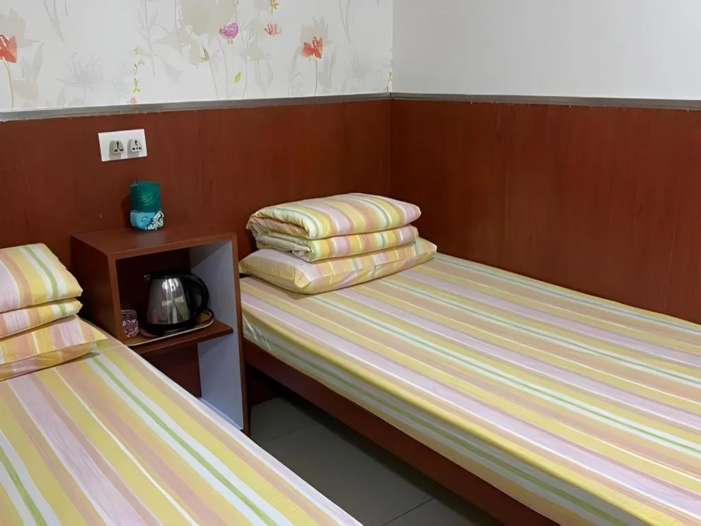 Bed in New Mong Kok Guest House