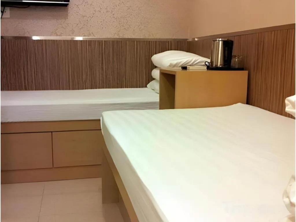 Bed in New Mong Kok Guest House