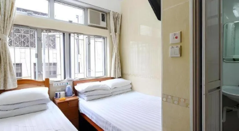 Bed in New Mong Kok Guest House