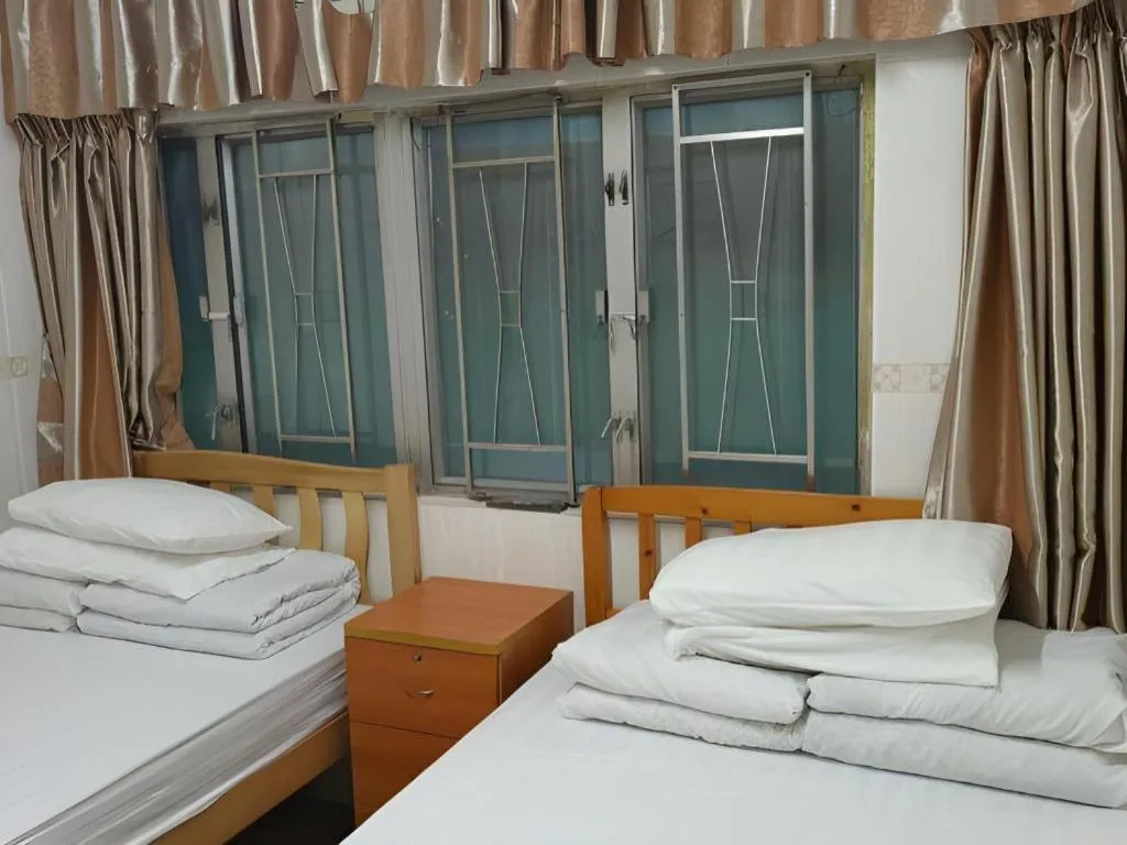 Bed in New Mong Kok Guest House