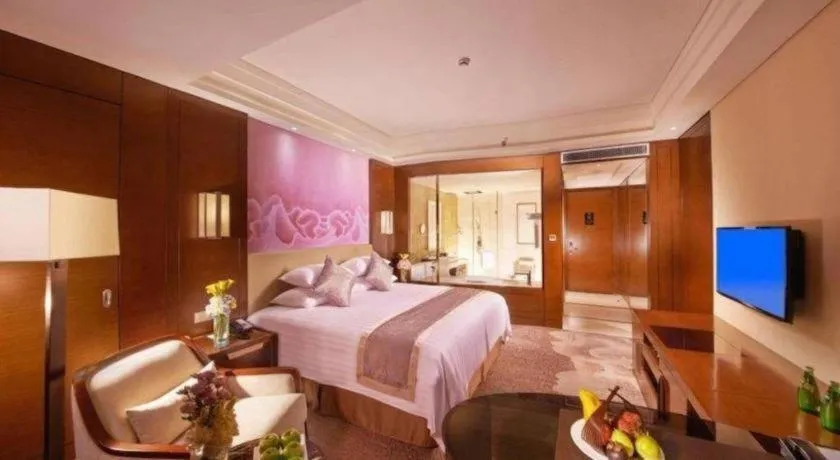 Bed in New Century Grand Hotel Hangzhou Fuyang Dongfangmao