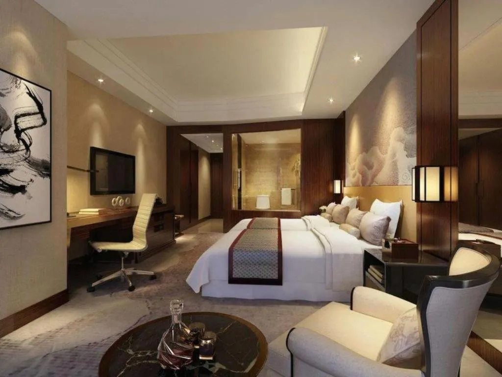 Bed in New Century Grand Hotel Hangzhou Fuyang Dongfangmao