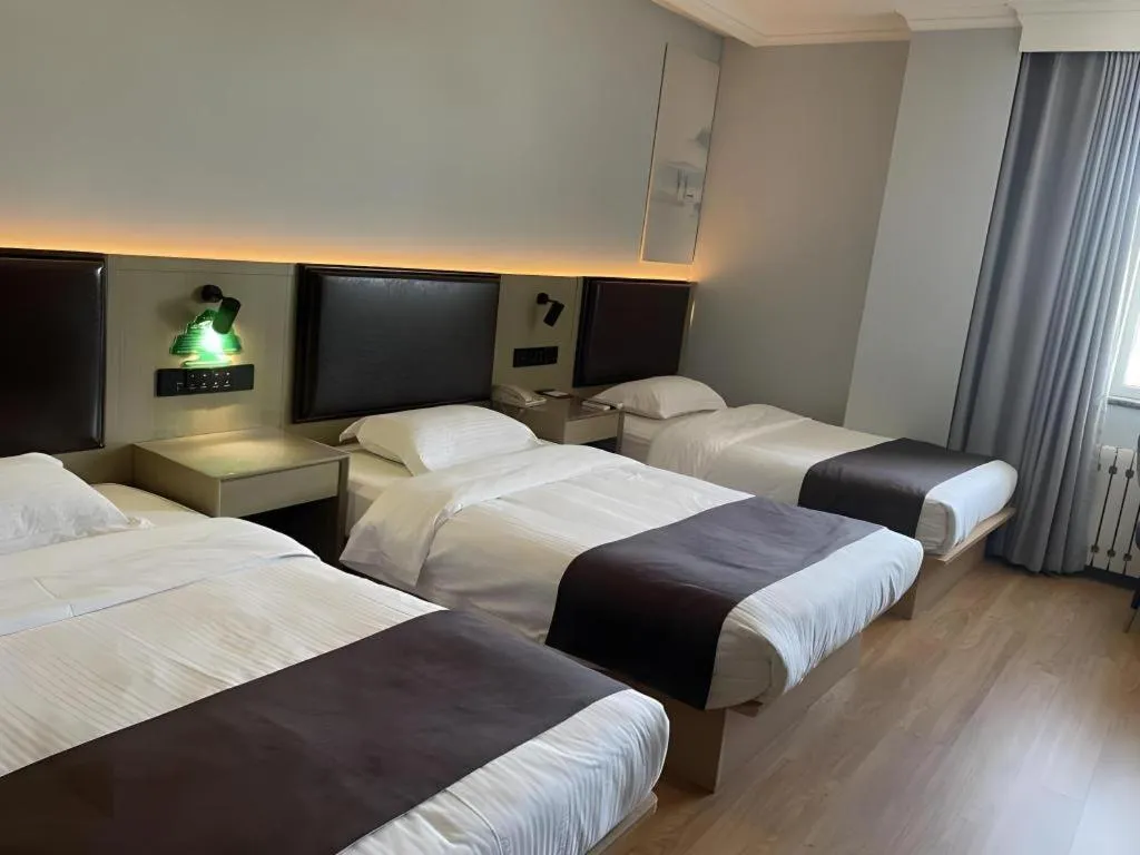 Bed in GreenTree Inn Liaoning Province Huludao City Xingcheng Shoushan Express Hotel