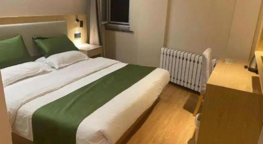 Bed in GreenTree Inn Liaoning Province Huludao City Xingcheng Shoushan Express Hotel