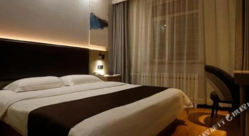 Bed in GreenTree Inn Liaoning Province Huludao City Xingcheng Shoushan Express Hotel