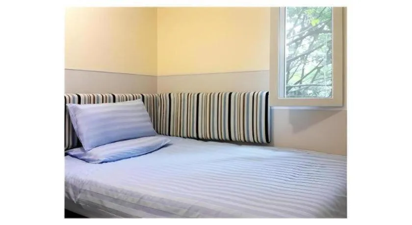 Bed in Hi Inn Guangzhou Gangding Metro Station