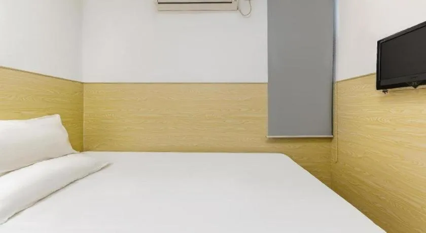 Bed in Hi Inn Guangzhou Gangding Metro Station