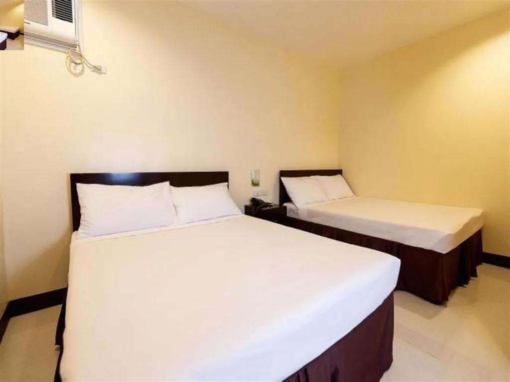 Bed in Winzelle Suites