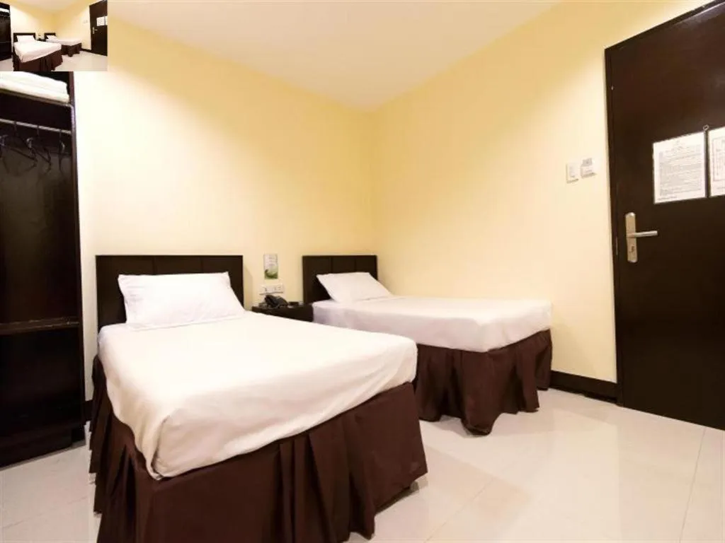 Bed in Winzelle Suites