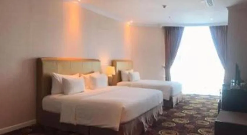 Bed in Adimulia Hotel Medan