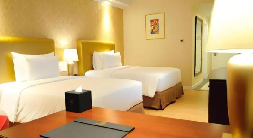 Bed in Adimulia Hotel Medan