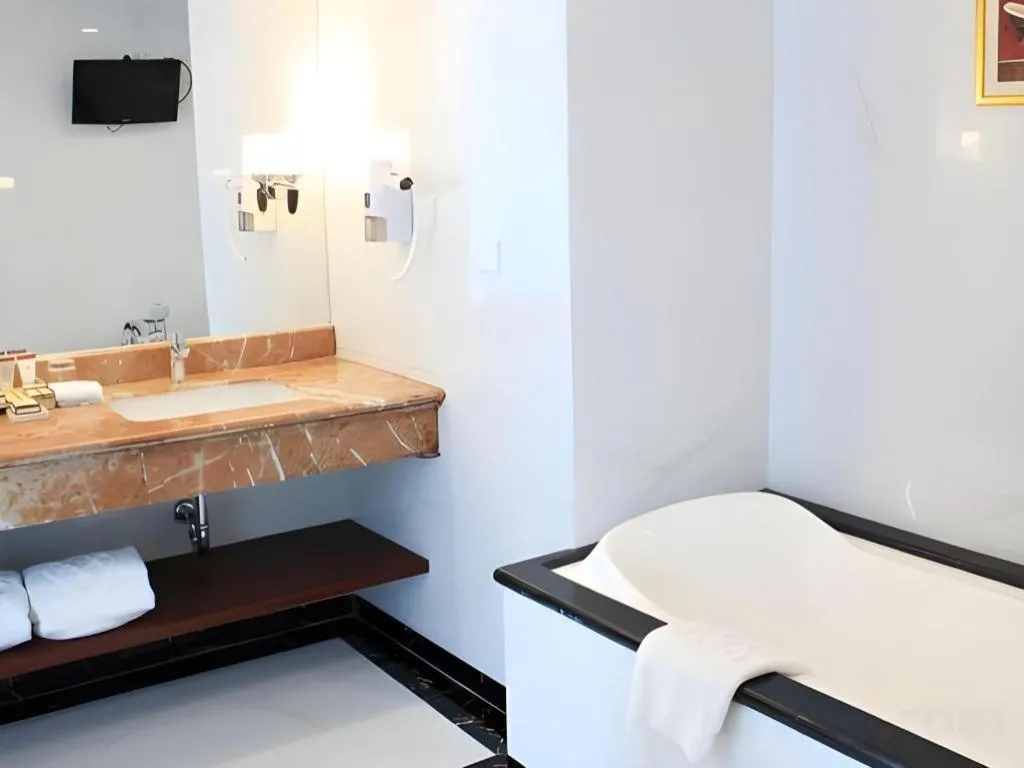 Bed in Adimulia Hotel Medan