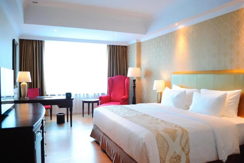 Bed in Adimulia Hotel Medan