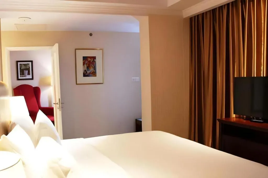 Bed in Adimulia Hotel Medan