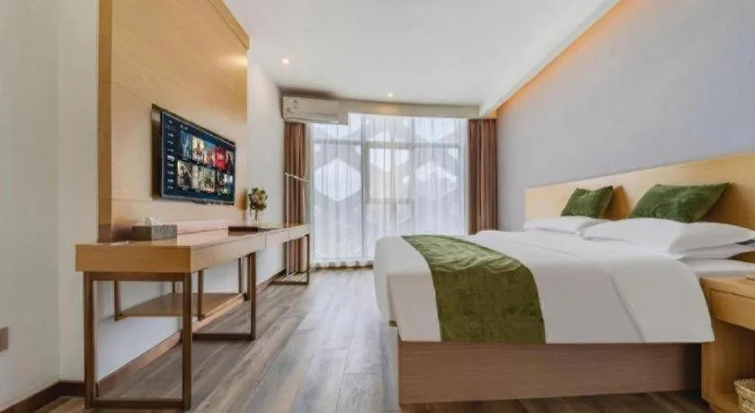 Bed in GreenTree Inn Nantong Zhangzhishan Town Deli Plaza Express Hotel