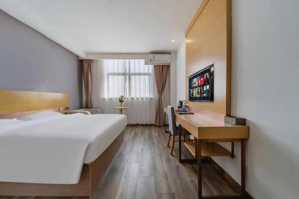 Bed in GreenTree Inn Nantong Zhangzhishan Town Deli Plaza Express Hotel