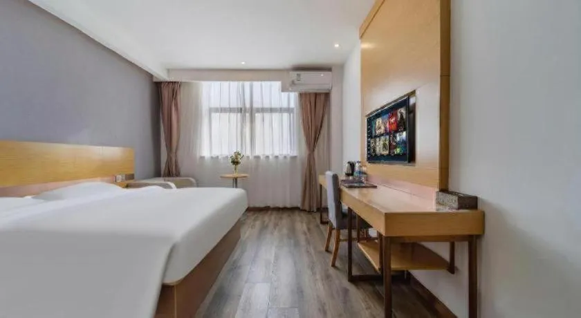 Bed in GreenTree Inn Nantong Zhangzhishan Town Deli Plaza Express Hotel