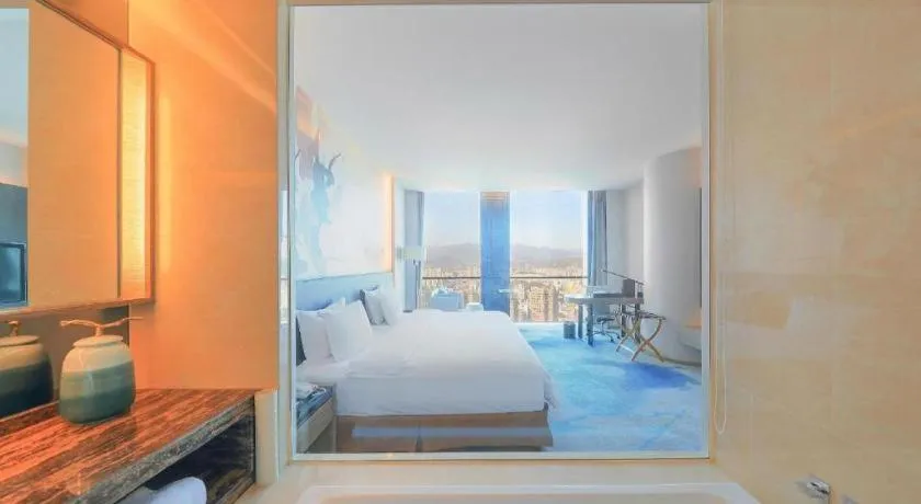 Bed in LONGYAN JINGHUA FLIPORT HOTEL