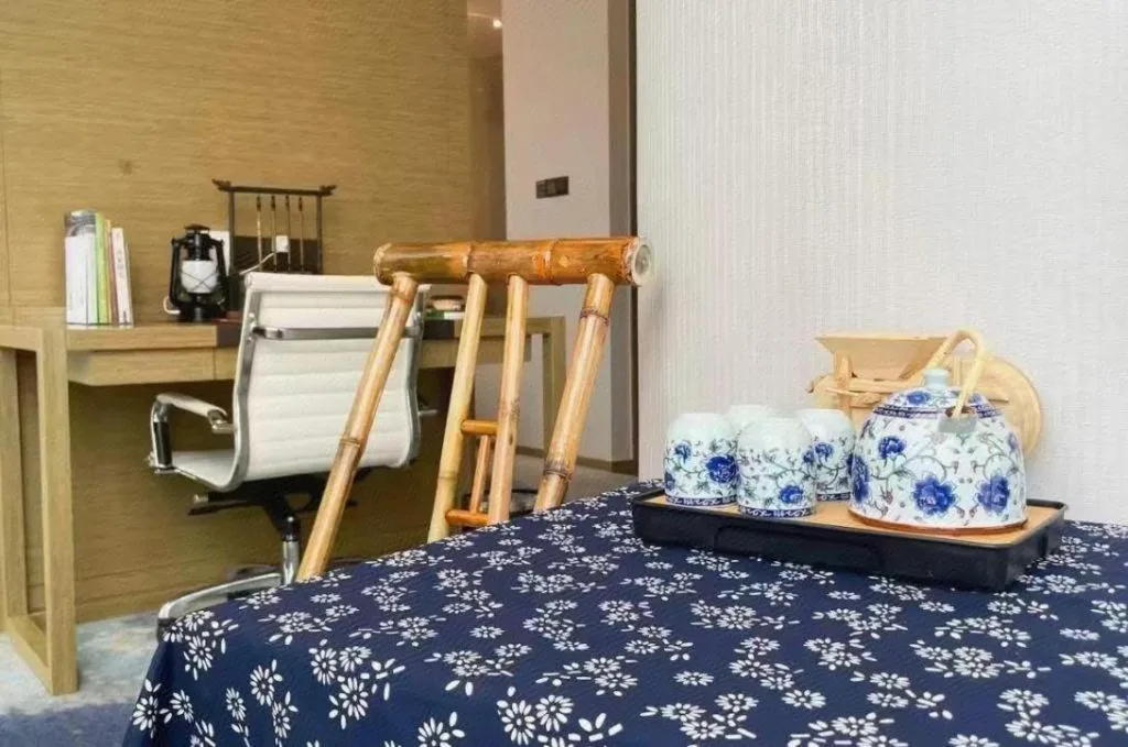 Bed in LONGYAN JINGHUA FLIPORT HOTEL