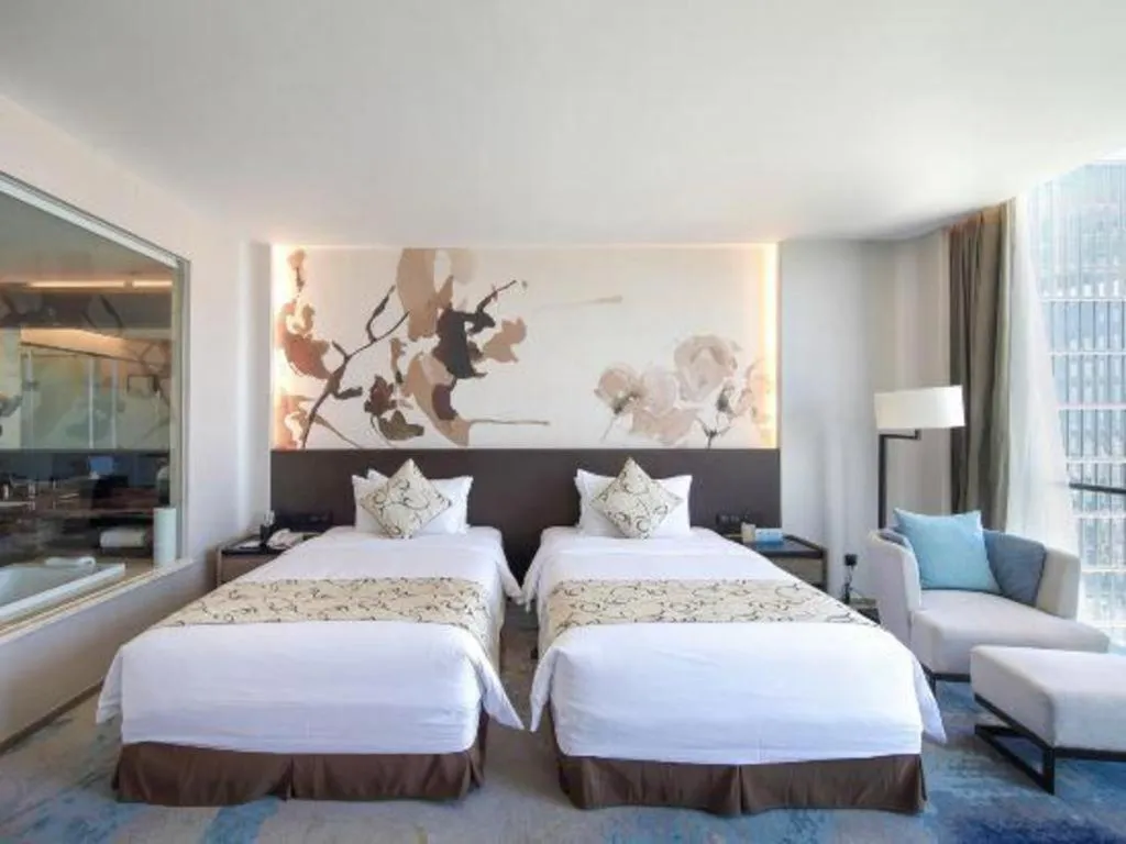 Bed in LONGYAN JINGHUA FLIPORT HOTEL