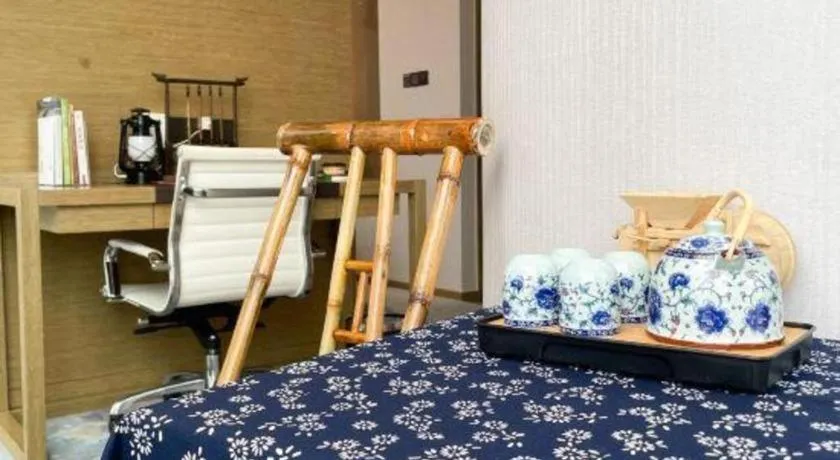 Bed in LONGYAN JINGHUA FLIPORT HOTEL