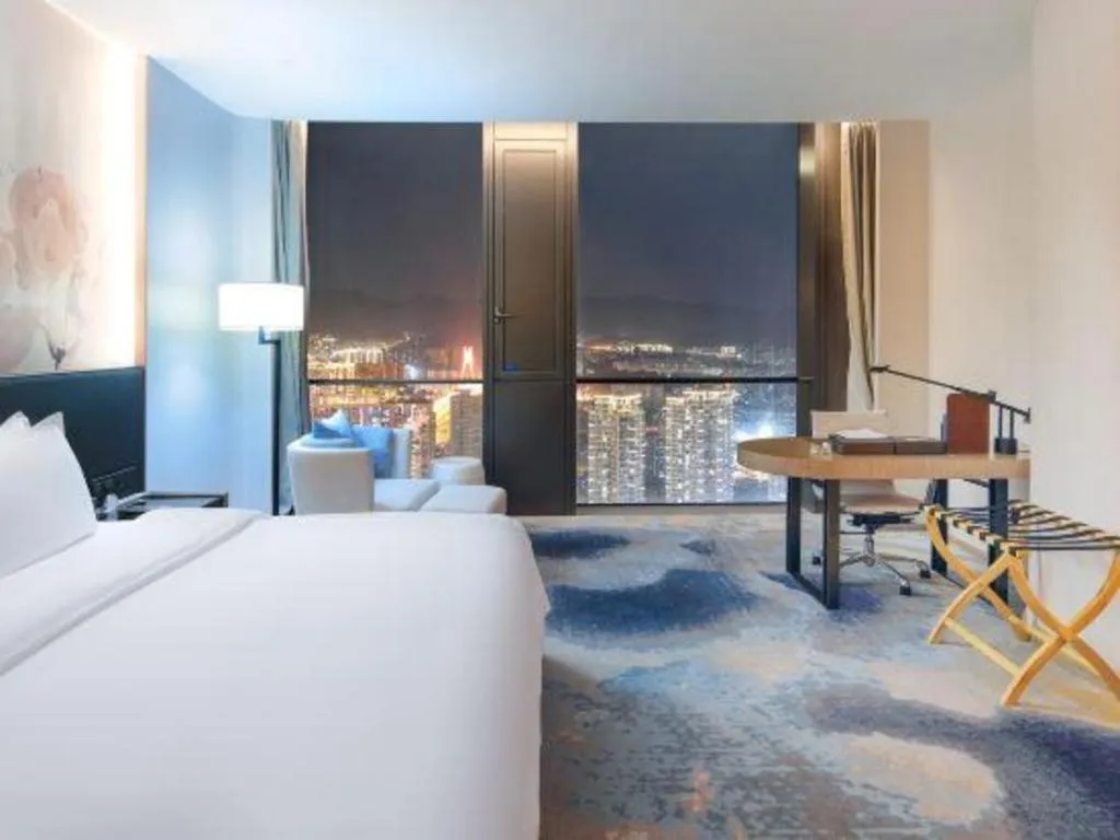 Bed in LONGYAN JINGHUA FLIPORT HOTEL