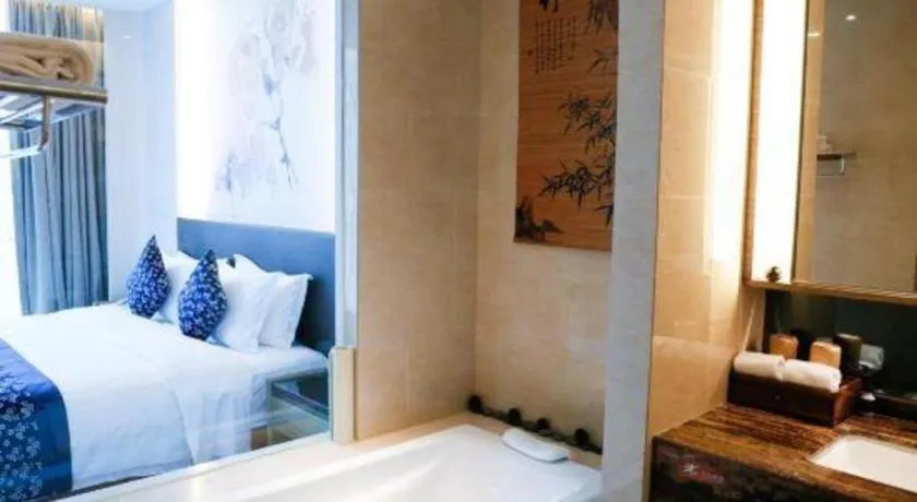 Bed in LONGYAN JINGHUA FLIPORT HOTEL