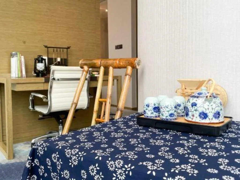 Bed in LONGYAN JINGHUA FLIPORT HOTEL