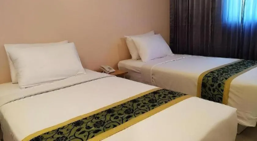 Bed in BIRD ROOM HOTEL - PRATUNAM